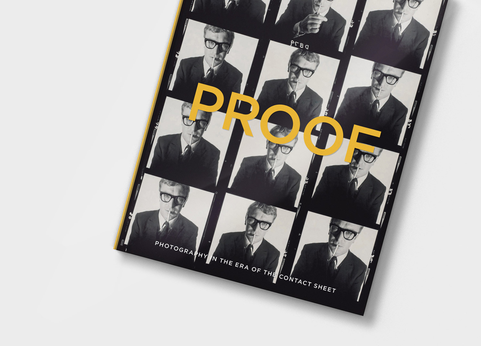 Angled view of PROOF book design with acetate cover and Micheal Caine contact sheet