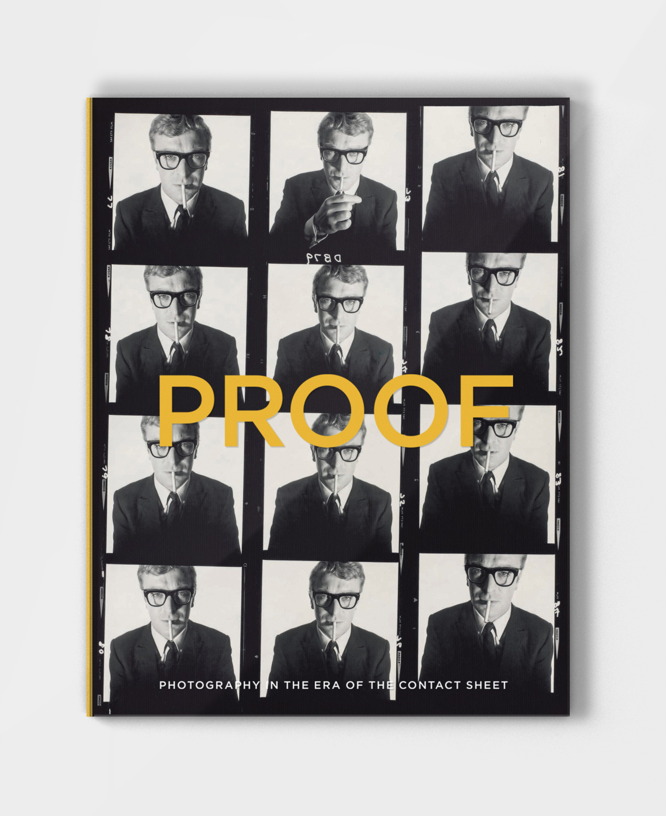 Book design cover showing "PROOF" in yellow on acetate, overlaying Micheal Caine contact sheet
