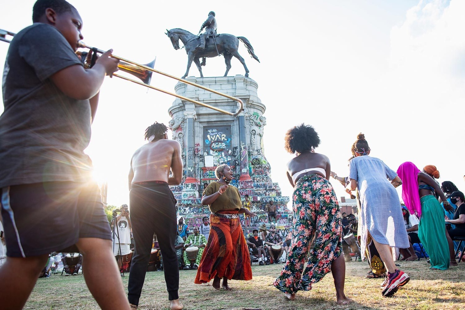 Brian Palmer photograph of protestors in front of Marcus-David Peters Circle in Richmond, VA with trumpeter in foreground